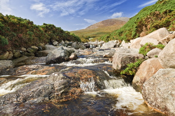 Fototapeta na wymiar Bloody Bridge river in the Mourne Mountains, near Newcastle, Northern Ireland. Landscape, historical place, tourist route.