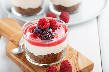 Cheesecake in glass  with fresh raspberries and cream cheese. Healthy homemade organic dessert.