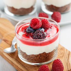 Cheesecake in glass  with fresh raspberries and cream cheese. Healthy homemade organic dessert.