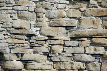 Stones and bricks of old medieval castle. Texture of wall.