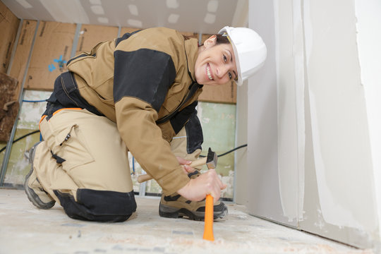 woman worker fixing her shoelaces