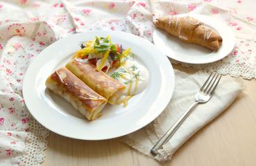 Breakfast with meat rolls and vegetable salad
