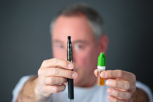 close-up of man hand holding electronic cigarette