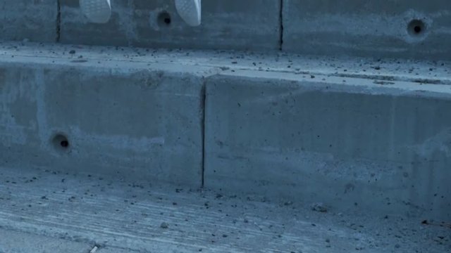 Girl jumping up stairs in Oslo, Norway.