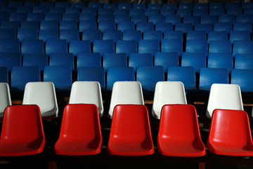 row of chairs in the room for spectators