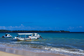 Vacation holidays concept background. Beautiful bay tropical island. Amazing marine view with boats, bright blue sky with clouds,clear colorful water in turquoise and azure tones. Nature landscape.