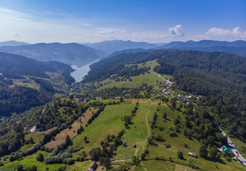 Obraz premium Mountain Spring lake (Izvorul Muntelui), Romania. Aerial view from professional drone