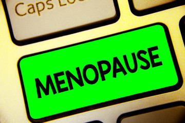 Word writing text Menopause. Business concept for Period of permanent cessation or end of menstruation cycle Keyboard green key Intention create computer computing reflection document.