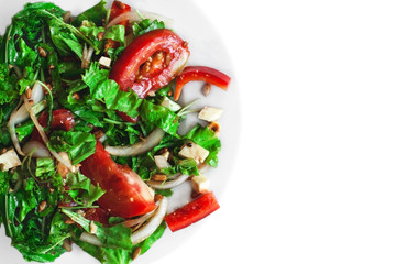 Falf plate fresh salad with tomatoes, nuts, arugula and cheese on white isolated background top view. Healthy food. Vegetarian food