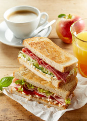 Breakfast set with sandwich, coffee and juice