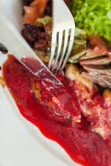 Closeup of a Salad with Chicken and Red Sauce