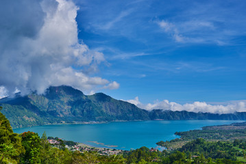 Fototapeta na wymiar Lake Buyan in Bali Island Indonesia - nature travel background. Mountain lake in the central part of Bali island. Beautiful lakes with turquoise water in the mountains. Landscape. Magnificent view.