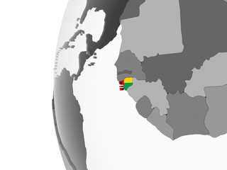 Guinea-Bissau with flag on globe
