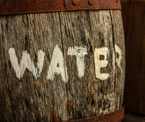 Old barrel of water in Key West harbor, Florida, USA.