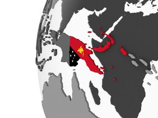Papua New Guinea with flag on globe