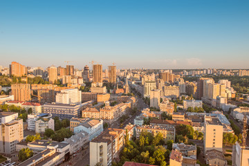 Fototapeta na wymiar High view cityscape of Kyiv city in sunset light.