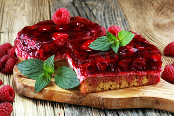 Raspberry Cake for holidays with mint and fresh delicious raspberries.