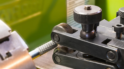 Two wheel knurling tools when working on a lathe. Sharp cutting wheels for grooving. Machining of a...