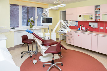 Stomatology interior of dental clinic with professional chair.