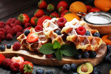 Traditional belgian waffles with fresh mint, sugar and raspberries.