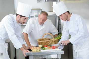 young chef to be cutting the ingredient