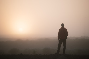 Man tourist meets dawn in Iceland