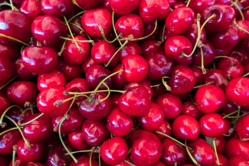 Fresh cherry stand at a street organic food market.