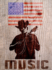 Cowboy in hat with mandolin on wooden background