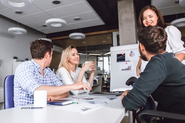 Team work of young creative entrepreneurs in the office