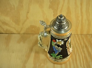 Classic German beer stein on the wooden background  , Summer in Ga USA. - obrazy, fototapety, plakaty