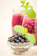 Blueberry smoothie close up photography with summer blended vitamin cocktail.
