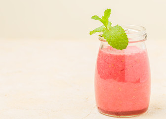 Raspberry smoothie close up photography with fresh summer blended cocktail and ripe berries.