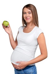 Young pregnant woman holding green apple isolated on white