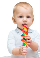 Portrait of a Cute Baby Eating Lollipop