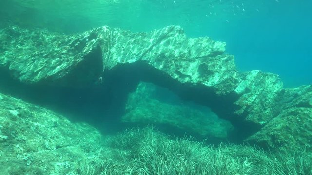 Rock formation underwater natural arch in the Mediterranean sea, Catalonia, Cap de Creus, Costa Brava, Spain
