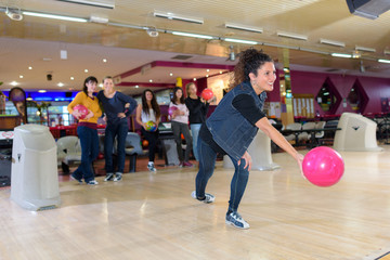 Lady launching bowling ball