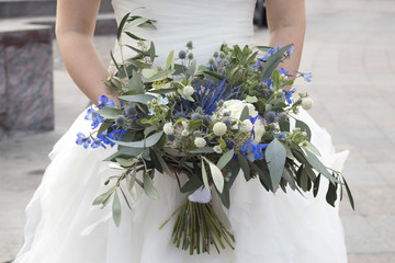 Wedding bouquet of dried flowers, eucalyptus, peony, dahlias and dolphinium