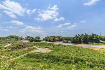 Fototapeta na wymiar 春の四街道の高龗神社の鳥居前から見た風景