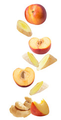 Flying fresh ginger and peaches isolated on white background