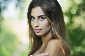 Portrait of young gorgeous lady with green lives, close up, shallow depth of field