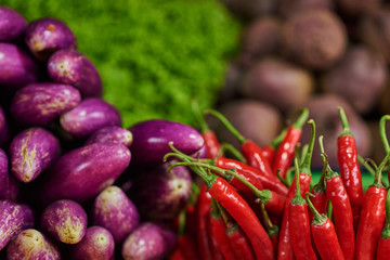 Various colorful raw vegetables on asian traditional market. Selective focus.