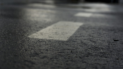 Asphalt background with a dividing strip, neon light