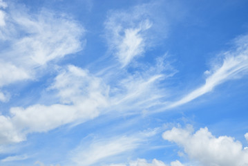 Naklejka na ściany i meble Fluffy white clouds on blue sky.