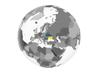 Ukraine with flag on globe isolated