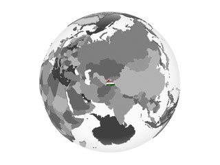 Tajikistan with flag on globe isolated