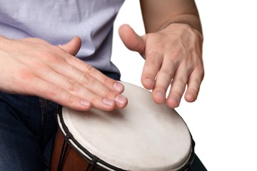 man playing a djembe