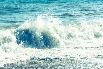 Vintage style image of waves crashing in the deep blue Mediterranean sea
