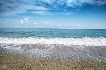 Stones on beach and sea water