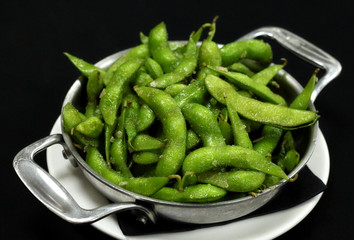 Boiled green soybeans in the pod.