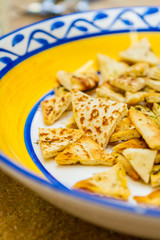 Closeup of Sliced Savoury Flatbread on a Decorative Plate